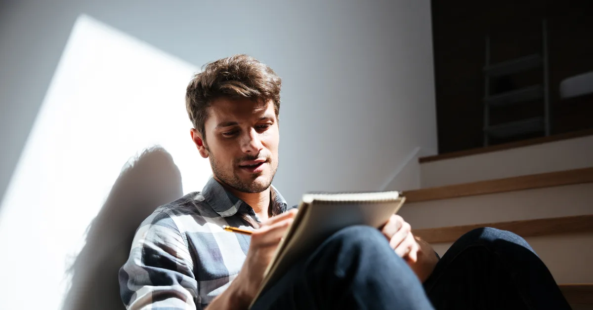 guy writing missionary fundraising letter