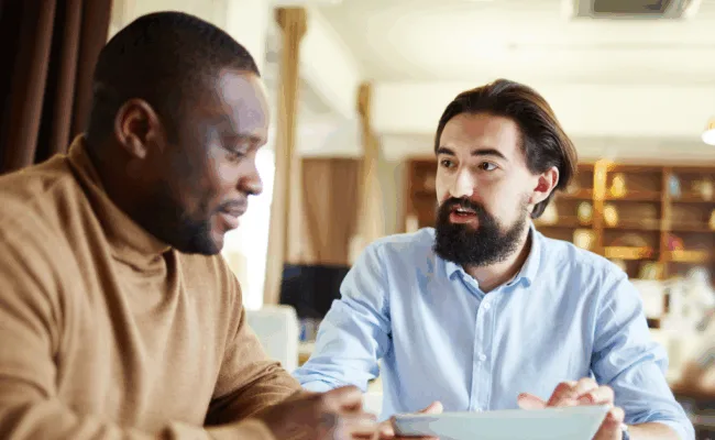 man donating to missionaries